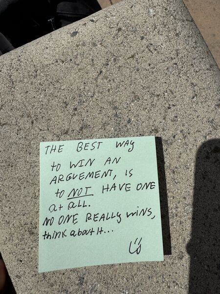 Handwritten sticky note with words of encouragement